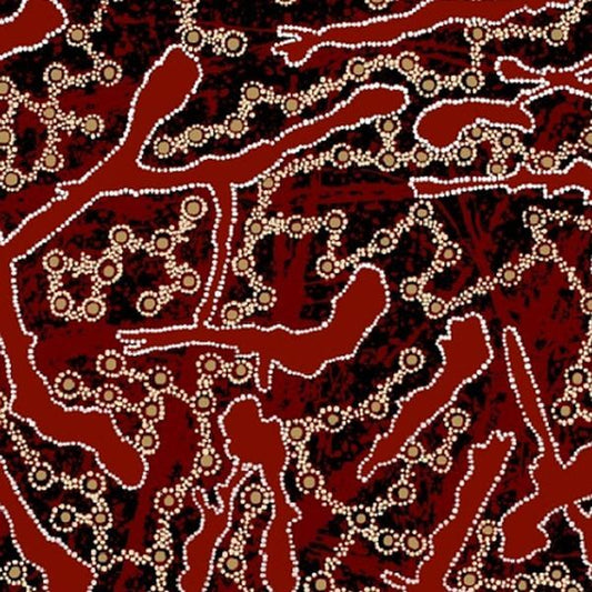 A close-up of a patterned Aboriginal fabric featuring a red and black background with beige dotted line art and circular motifs.