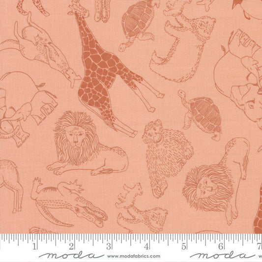 A close-up of Moda's Fabrics safari-themed fabric featuring brown line-art illustrations of animals (giraffe, lion, elephant, turtle, monkey, crocodile) on a peach-pink background, with a white ruler at the bottom showing measurement scale.