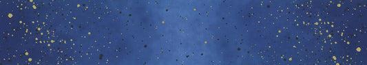 A square blue textured background with scattered small gold and black speckles, resembling a glittery or metallic starry surface.