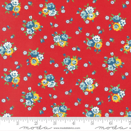 Red fabric with a vintage floral pattern featuring blue, yellow, and white flowers, shown with a measuring ruler at the bottom to indicate scale. The brand 'Moda Fabrics' is watermarked at the bottom.