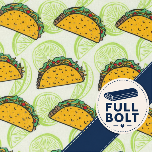 A repeating pattern of yellow tacos with green lettuce and red peppers on a light cream background with green lime slices, plus a dark blue diagonal stripe and a white circular badge reading FULL BOLT with a folded blue fabric icon.
