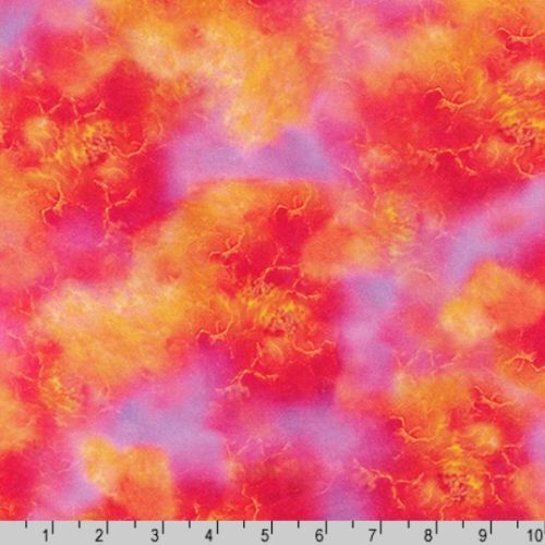 A close-up of a fabric with an abstract marbled pattern in bright pink, red, orange, and yellow, with a 10-inch ruler along the bottom edge for scale.