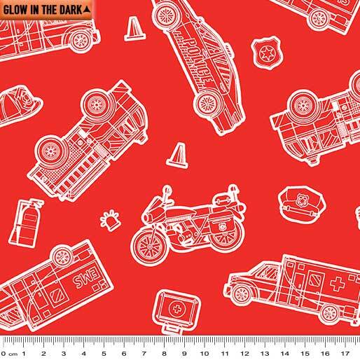 Red fabric with a white outline pattern of emergency vehicles and roadside icons, including a motorcycle, ambulance, fire truck, police car, cones, and a ruler scale at the bottom.
