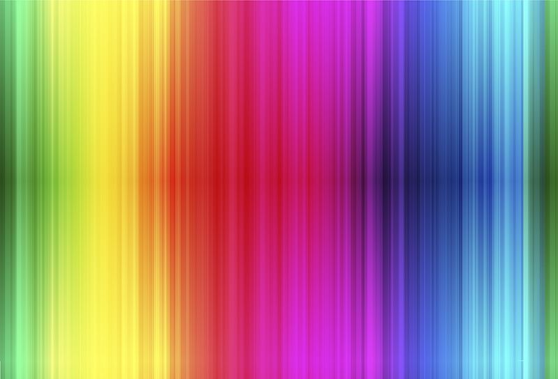 A vertical rainbow gradient pattern with smooth color bands transitioning from green and yellow on the left, through red and orange, into purple, blue, and cyan on the right.