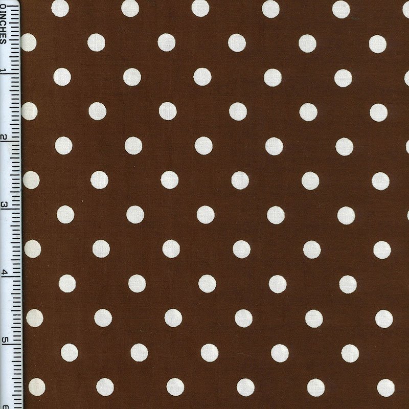 Brown fabric with a white polka dot pattern, shown flat with a ruler on the left edge for scale.