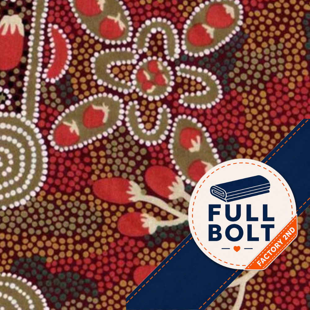 A close-up of a patterned fabric featuring an Aboriginal-style dot art design with red, brown, beige, and white motifs. A dark blue diagonal banner overlays the bottom right corner, with a white circular badge reading 'FULL BOLT' and 'FACTORY 2ND'.