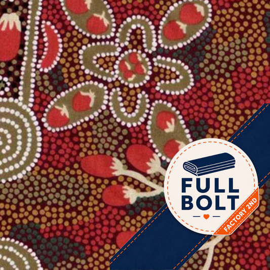 A close-up of a patterned fabric featuring an Aboriginal-style dot art design with red, brown, beige, and white motifs. A dark blue diagonal banner overlays the bottom right corner, with a white circular badge reading 'FULL BOLT' and 'FACTORY 2ND'.