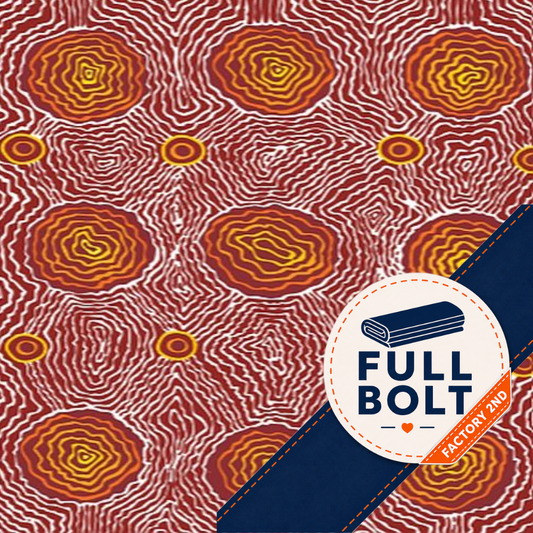 A close-up of patterned fabric with a repeating abstract design in red, orange, yellow, and white, plus a dark navy diagonal banner across the lower right containing a circular 'FULL BOLT' logo and an orange 'FACTORY FLOW' tag.