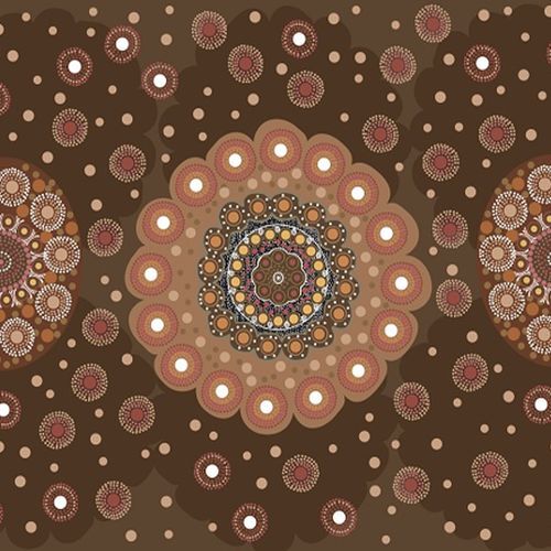 A repeating circular dot fabric pattern in earthy tones, with a large central mandala-like motif and smaller matching motifs around it on a dark brown background.