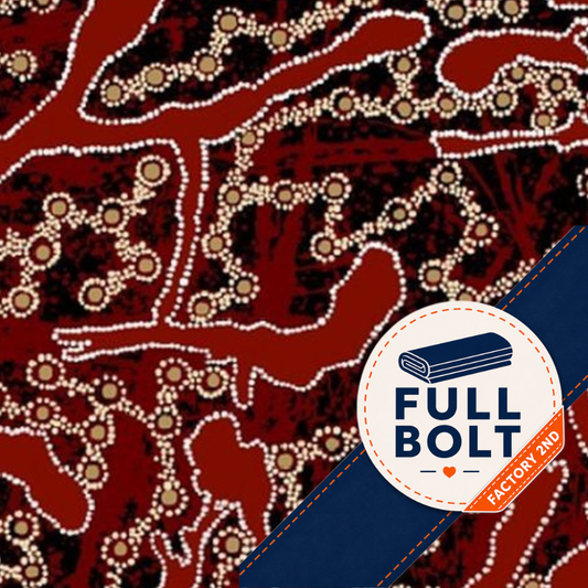 A close-up of a patterned fabric with a red background, dark navy areas, and white dotted linework in an Aboriginal style. A circular badge in the lower right reads 'FULL BOLT' with 'FACTORY 2ND' on an orange ribbon.