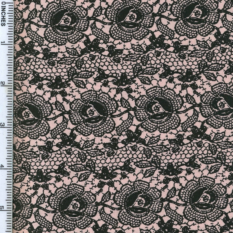 A delicate dusty pink lace-inspired print from the Lady Claire collection by Blank Quilting, bringing a soft and elegant look to quilting and sewing projects