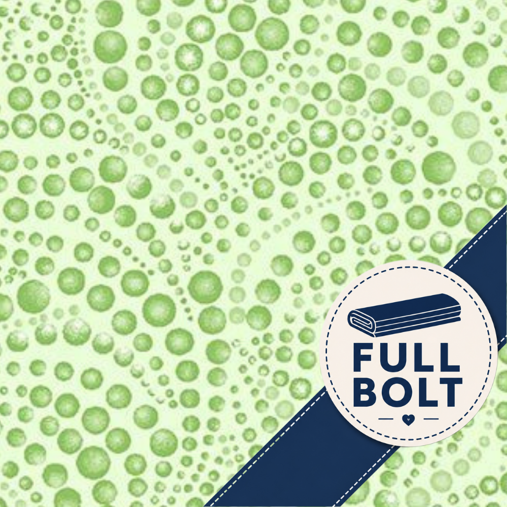 A close-up of a light green fabric with a repeating pattern of darker green circles, overlaid with a dark blue diagonal ribbon in the lower right corner that has a white circular label reading 'FULL BOLT'.