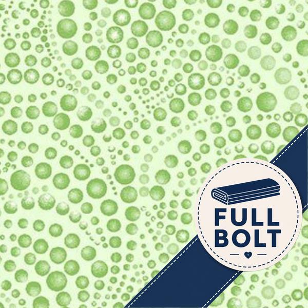 A close-up of a light green fabric with a repeating pattern of darker green circles, overlaid with a dark blue diagonal ribbon in the lower right corner that has a white circular label reading 'FULL BOLT'.