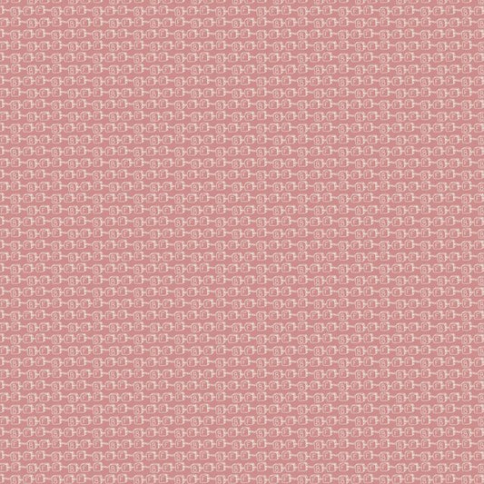 A close-up of a dusty pink woven fabric with a repeating pattern of small white and light pink geometric shapes with BFF written on them