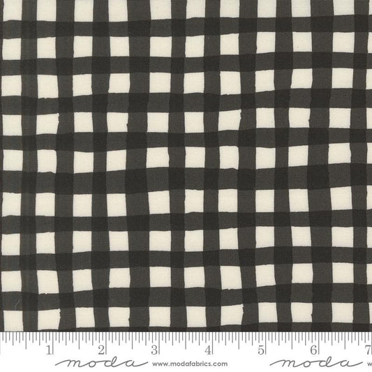 Charcoal Black and white gingham fabric pattern shown close up with a ruler at the bottom indicating scale. The brand name 'moda' is visible on the ruler watermark.