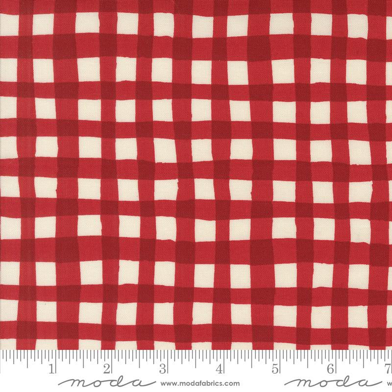 Red and off-white gingham checkered fabric shown flat, with a ruler along the bottom edge for scale. The Modas Fabrics watermark is visible at the bottom.