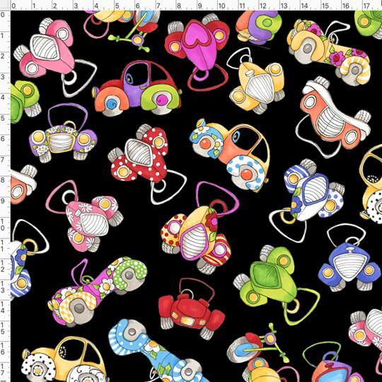A close-up of a fabric pattern featuring colorful retro toy cars on a black background, with a white measurement ruler visible along the top and left edges.