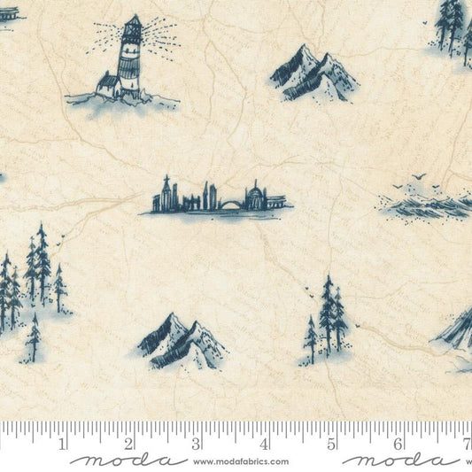 Beige fabric with a repeating blue toile-style print of lighthouses, mountains, trees, and a city skyline, shown with a ruler along the bottom edge. Moda branding is visible at the bottom.