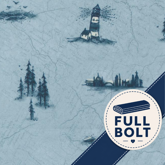 A close-up of a light blue fabric with a navy blue illustrated map pattern featuring a lighthouse, trees, and buildings. A white circular badge with a navy ribbon and the text 'FULL BOLT' is overlaid in the lower right corner.