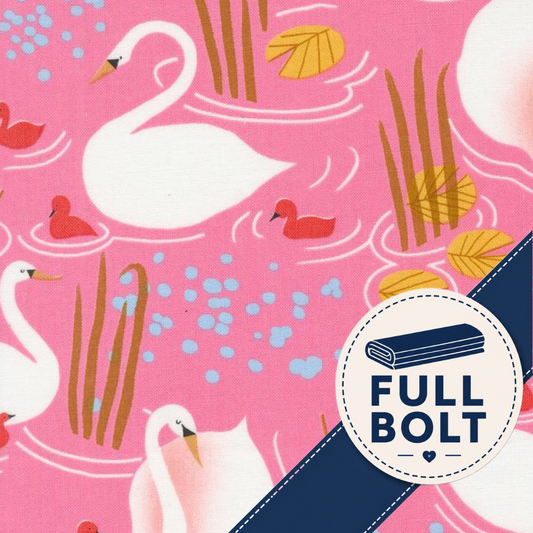 Pink fabric with a whimsical duck pond pattern featuring white swans, red ducks, yellow reeds and leaves, blue water spots, and a navy diagonal band with a circular 'FULL BOLT' badge.
