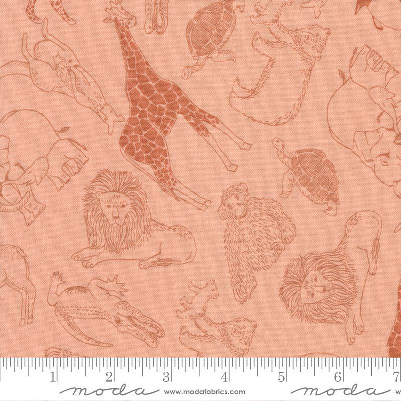 A close-up of Moda's Fabrics safari-themed fabric featuring brown line-art illustrations of animals (giraffe, lion, elephant, turtle, monkey, crocodile) on a peach-pink background, with a white ruler at the bottom showing measurement scale.
