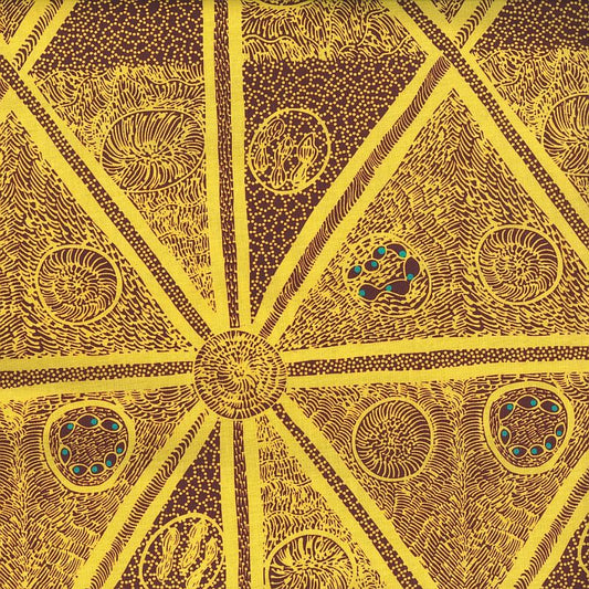 A close-up of a textile pattern featuring a symmetrical geometric design in bright yellow and dark brown, with intricate dotted and textured details.