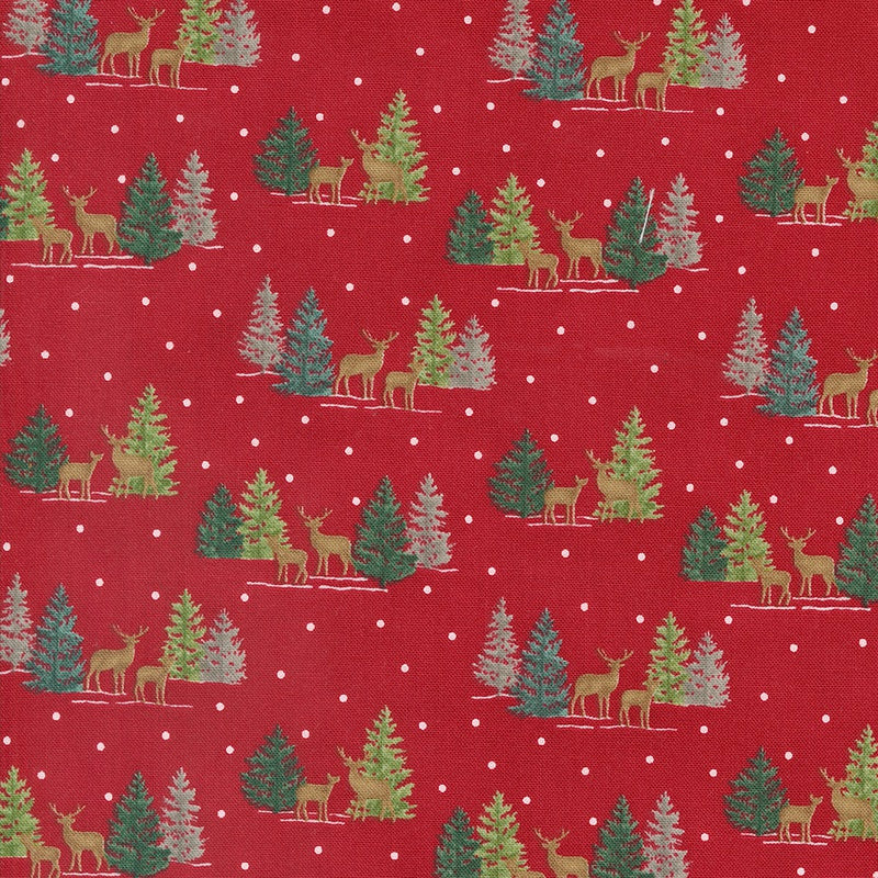 Red fabric with a repeating Christmas pattern of green and beige deer, pine trees, and small white snow dots.