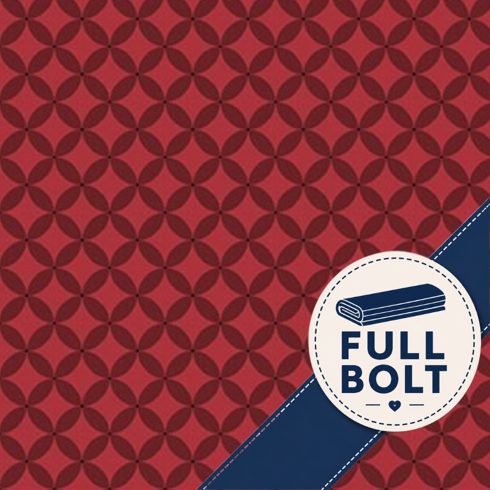 A red fabric with a repeating geometric medallion pattern, featuring a navy blue diagonal ribbon and a circular white badge that reads 'FULL BOLT' with a folded fabric icon.
