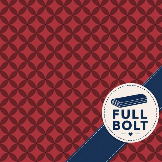 A red fabric with a repeating geometric medallion pattern, featuring a navy blue diagonal ribbon and a circular white badge that reads 'FULL BOLT' with a folded fabric icon.