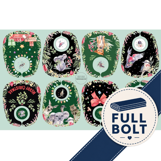 A fabric panel showing eight decorative baby bibs with illustrated animals, flowers, and holiday motifs on black and green backgrounds, plus a blue diagonal banner reading FULL BOLT.