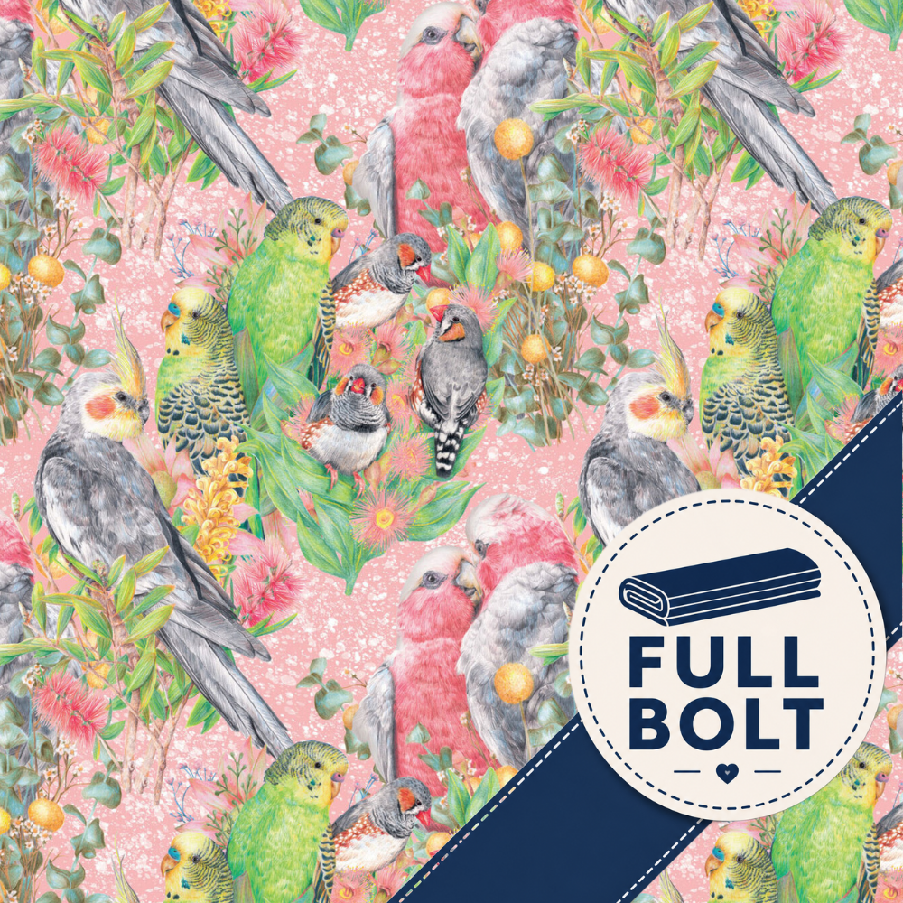 A repeating fabric pattern featuring colorful Australian birds, flowers, and leaves on a light pink background, with a dark navy diagonal band and a circular badge reading FULL BOLT.