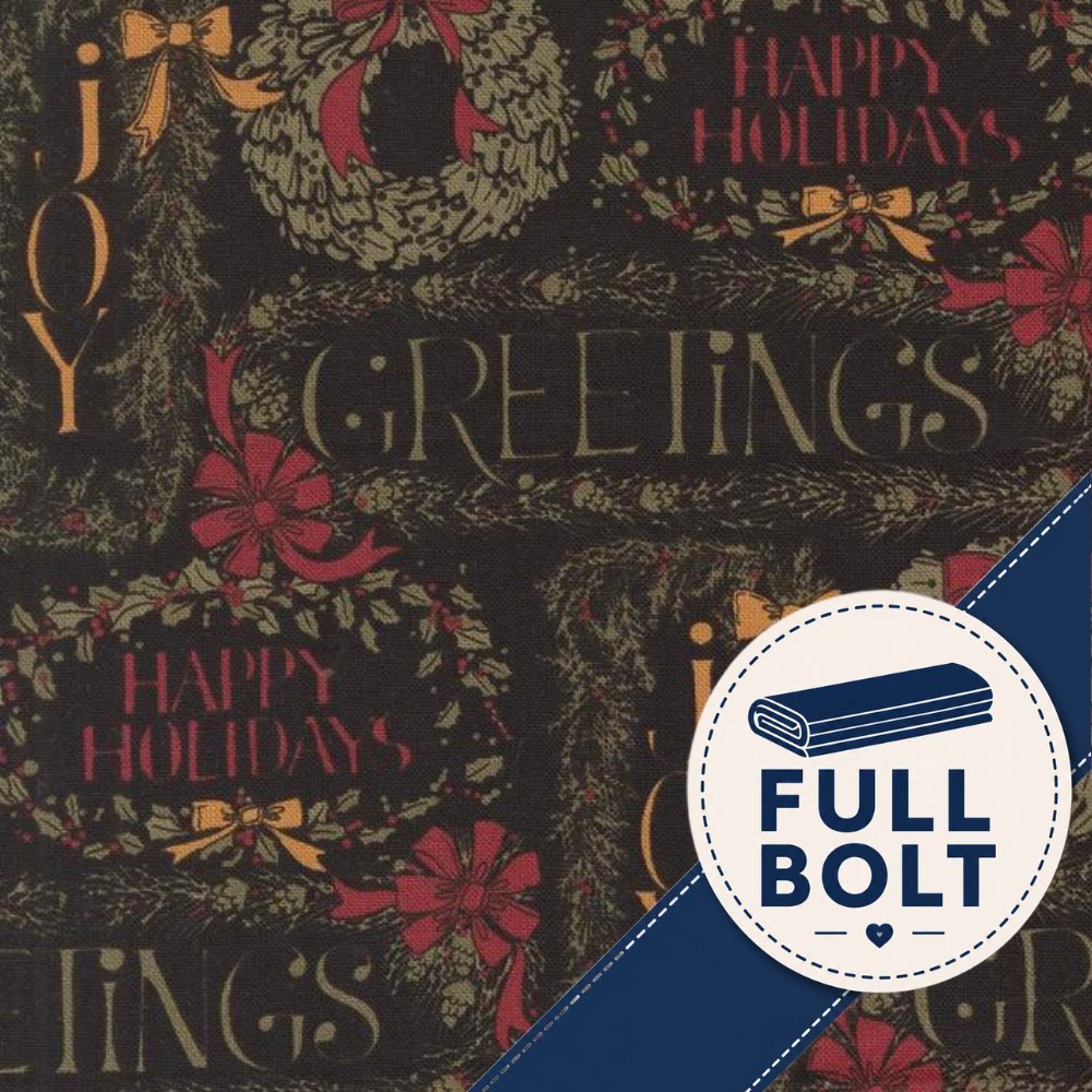 Christmas-themed fabric pattern with wreaths, bows, and the words 'JOY GREETINGS HAPPY HOLIDAYS' on a dark background, plus a blue diagonal band and a circular 'FULL BOLT' badge.