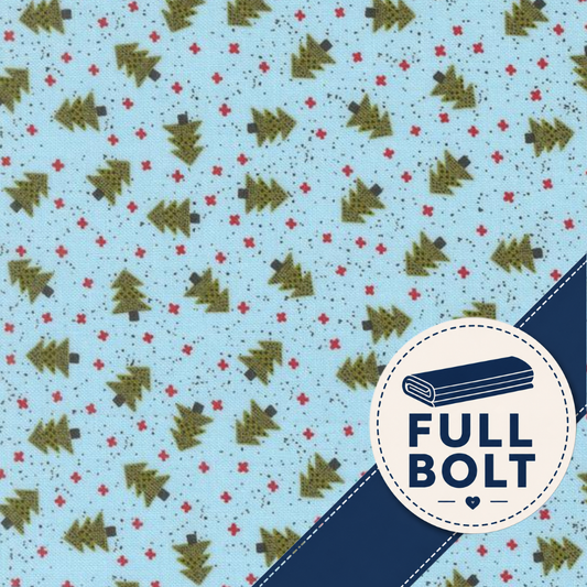 Light blue fabric with a repeating pattern of olive green Christmas trees and small red stars, plus a navy diagonal band and a circular badge reading FULL BOLT.