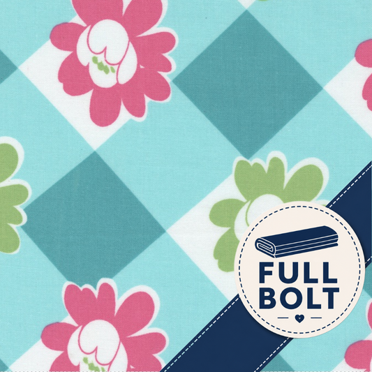 A close-up of patterned fabric with pink and green flowers on a light aqua and white check background, plus a navy diagonal band and a circular badge reading FULL BOLT.