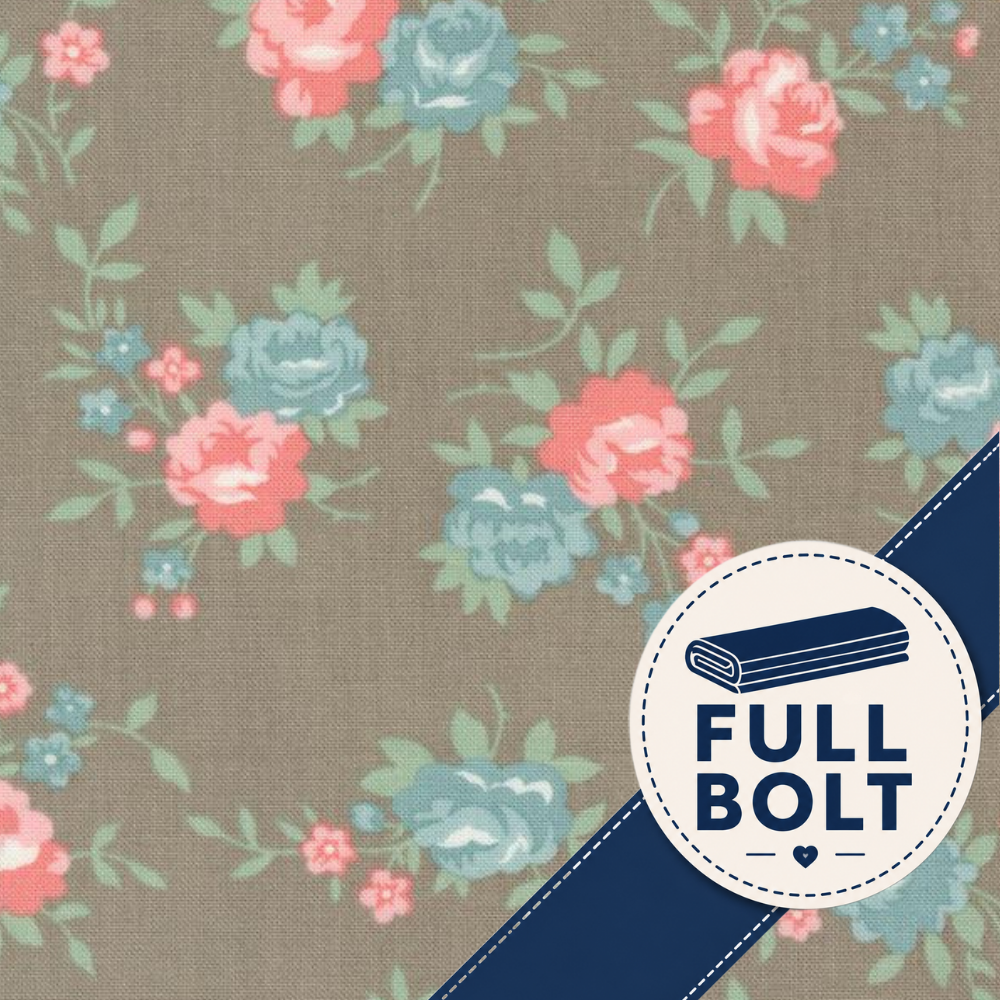 Floral fabric pattern with pink and blue roses on a taupe background, overlaid with a navy diagonal stripe and a circular 'FULL BOLT' badge.
