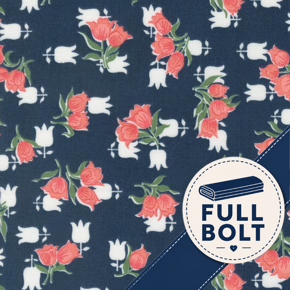 A close-up of a fabric pattern featuring coral-pink tulips and white tulips on a dark navy background, with a circular badge reading FULL BOLT and a navy diagonal stripe in the lower right corner.