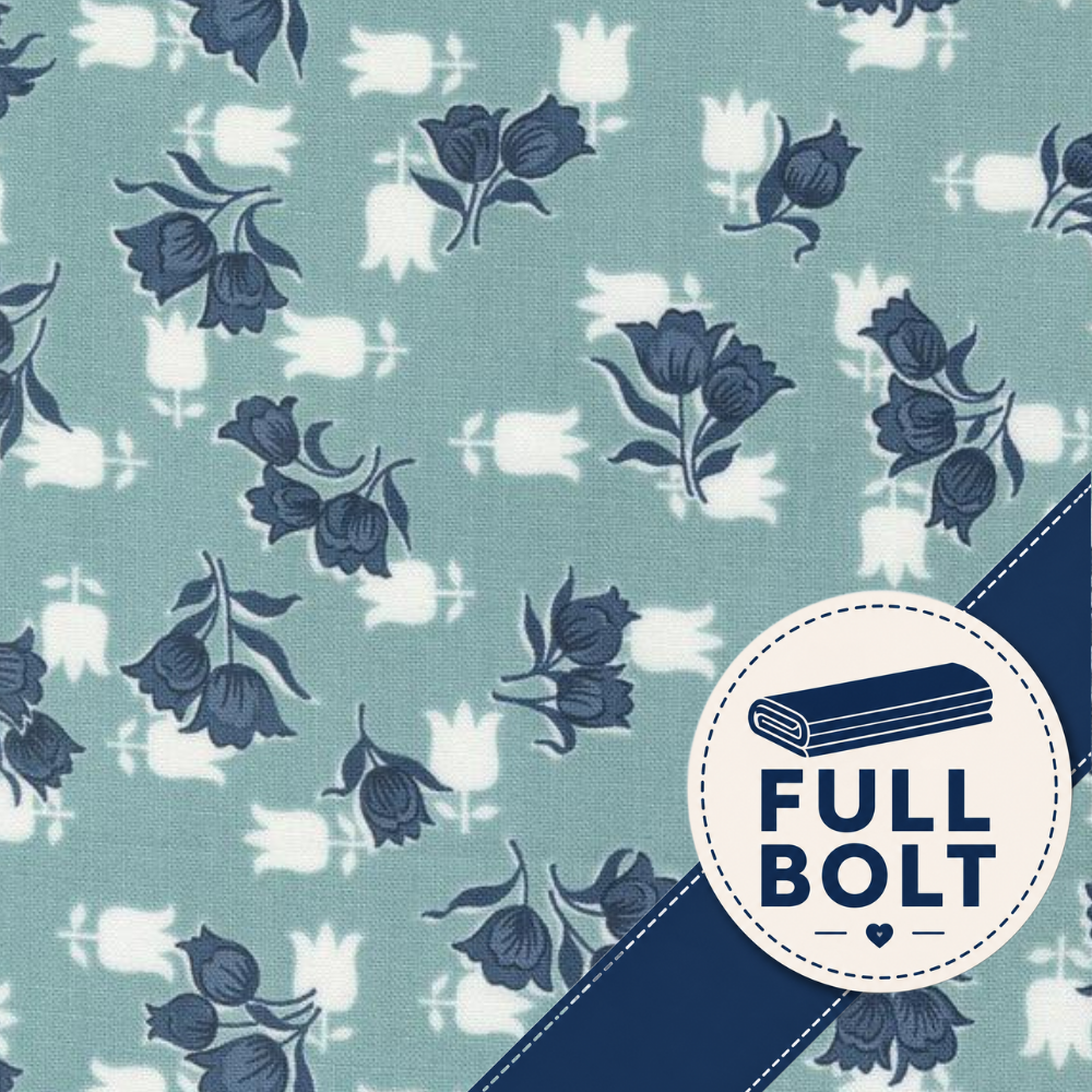 A close-up of fabric with a repeating floral print on a muted blue-green background, featuring dark blue flower motifs and white tulip silhouettes. A circular badge in the lower right says FULL BOLT with a rolled fabric icon and a dark blue diagonal stripe across the corner.
