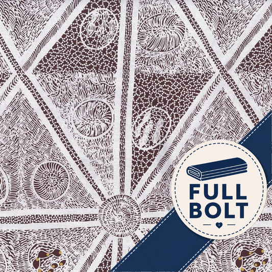 A close-up of a patterned fabric with a white base and dark burgundy geometric Aboriginal print, featuring a navy blue diagonal stripe and a circular white badge with the text 'FULL BOLT' and a folded fabric icon.