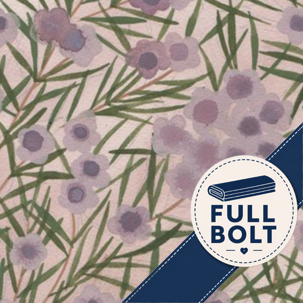 A close-up of a fabric pattern featuring purple flowers and green leaves on a light pink background, with a navy blue diagonal banner in the lower right corner containing a white circular badge that reads 'FULL BOLT'.