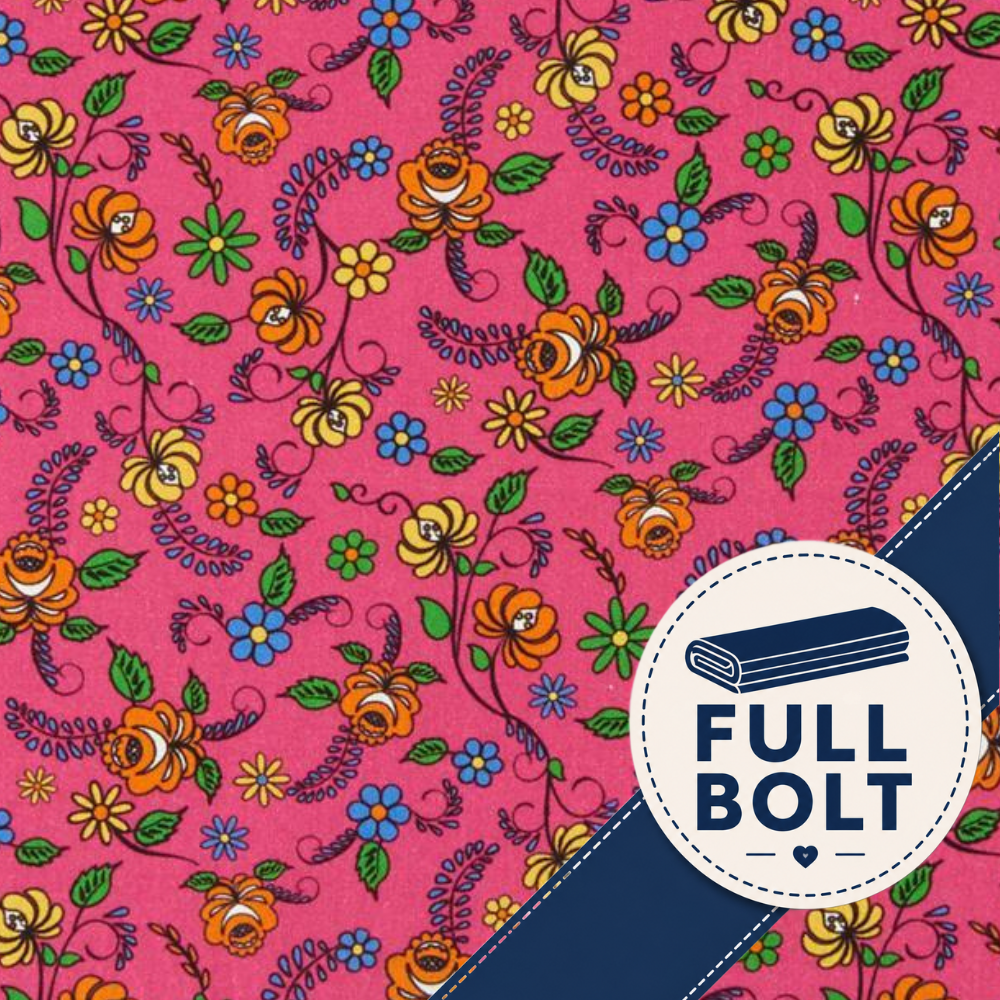 A close-up of a pink fabric or wallpaper pattern with a dense floral print in yellow, orange, blue, and green, overlaid with a dark navy diagonal band and a circular badge reading 'FULL BOLT'.