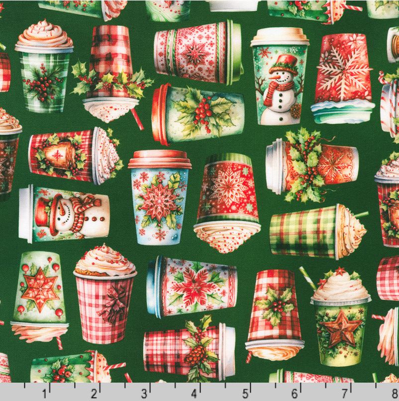 A festive holiday coffee cup pattern on a dark green background, featuring illustrated cups with snowmen, snowflakes, holly, hot chocolate, and whipped cream. A measurement ruler is visible along the bottom edge.