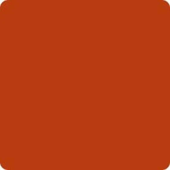 A solid terracotta orange color  fabric swatch with rounded corners.