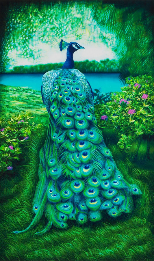 A stylized fabric panel of a peacock with a full tail of blue-green feathers standing in a lush garden with green foliage, pink flowers, and a blue body of water in the background.