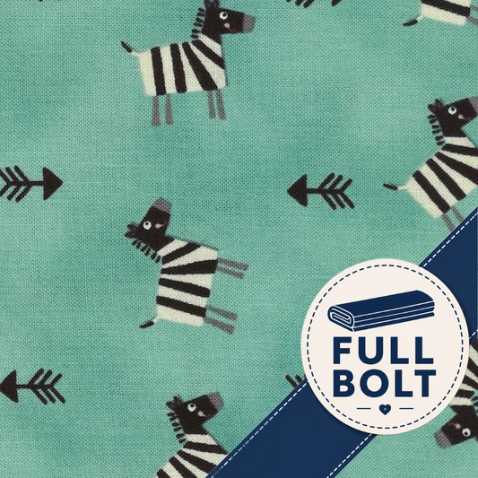 A close-up of fabric showing a repeating pattern of zebra animals and black arrows on an aqua green background, with a blue diagonal band and a circular badge reading “FULL BOLT.”.